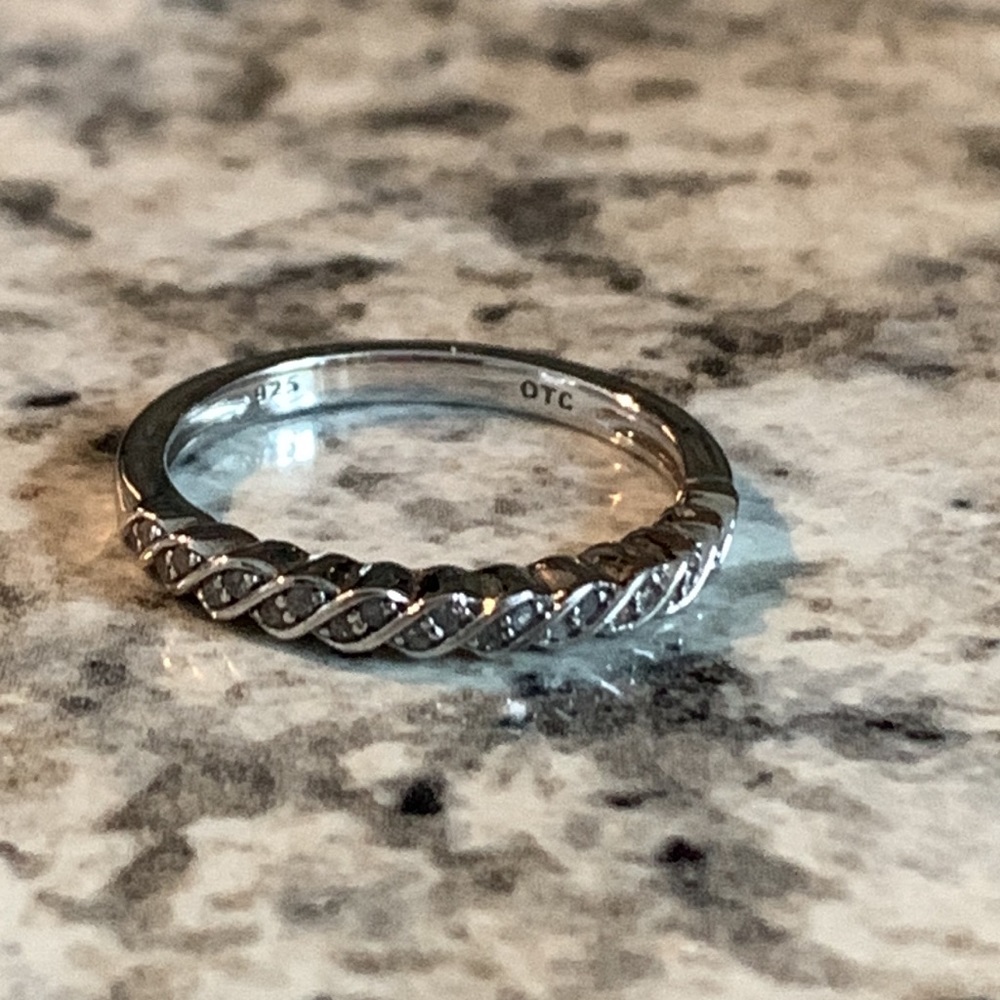 Silver diamond wedding band.